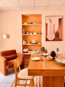 a living room with a table and a chair at FUTURA ROOM&RELAX in Termoli