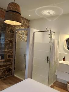 a bathroom with a shower with a glass door at Bellavista Room Bakio in Bakio