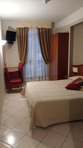 Voodi või voodid majutusasutuse Hotel Cavour toas