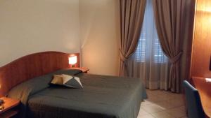 Voodi või voodid majutusasutuse Hotel Cavour toas