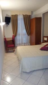 Voodi või voodid majutusasutuse Hotel Cavour toas