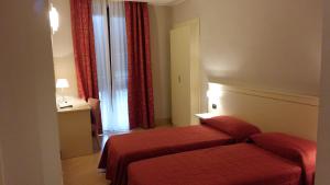 Voodi või voodid majutusasutuse Hotel Cavour toas