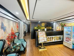 a dining room with a sign on the wall at Diamond Villa in Hanoi