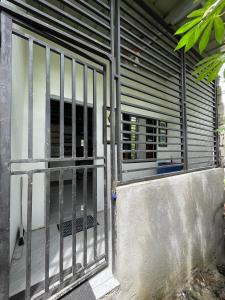 an entrance to a building with a metal gate at Lavish style at Laguna by Nelson in Biñan
