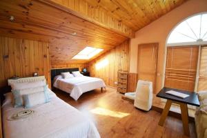 a bedroom with two beds and a desk in it at Villa la cantera in Guadarrama +86 photos