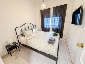 a bedroom with a bed and a window at Marbella Skol in Marbella +30 photos
