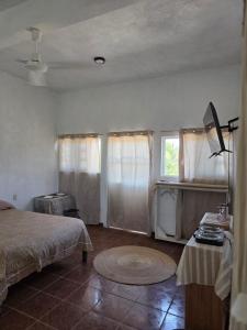 a bedroom with a bed and a window at Estudio Arena in Brisas de Zicatela +5 photos
