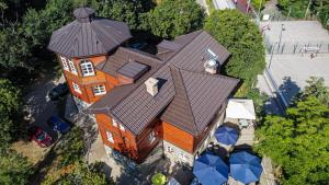 an overhead view of a large house with a roof at Avala apartments in Beli Potok +4 photos