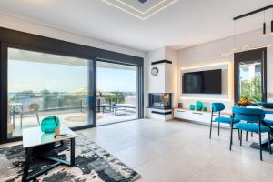 a living room with a view of the ocean at Inception Luxury Villas in Nea Skioni