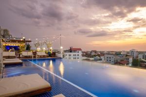 a large swimming pool on the roof of a building at Two Seasons Siem Reap Hotel in Siem Reap +74 photos