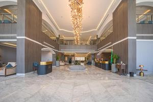 a large lobby with a large ceiling with a chandelier at Grand Iva Hotel Abha in Abha +61 photos