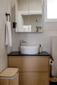 a bathroom with a sink and a mirror at El Koulador House in Ialysos +19 photos