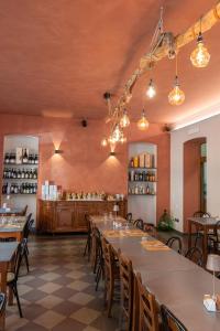 a dining room with tables and chairs and a counter at Dal Brascin in Corio