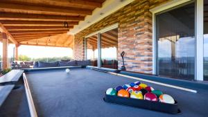a house with a pool table in the living room at Villa AD Astra by Villas Guide in Sesvete