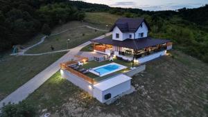 an aerial view of a house with a swimming pool at Villa AD Astra by Villas Guide in Sesvete