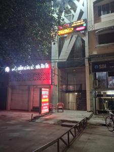 a building with a sign on the side of it at HOTEL RAJBHOG indore in Indore