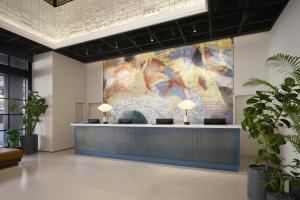 a large tapestry on the wall in a lobby at GRAVITY JOSUN Seoul Pangyo, Autograph Collection in Seongnam