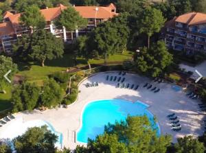 an overhead view of a large swimming pool in a resort at L escale Oceane in Moliets-et-Maa
