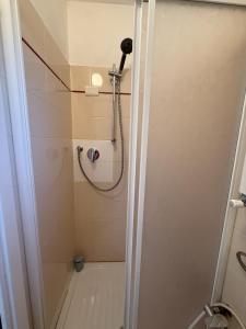 a shower in a bathroom with a glass door at Il Filo di Arianna 2 in Polverara