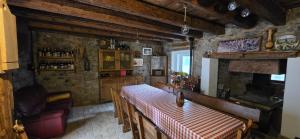 a dining room with a table and a bar at Casa APOLLO in Palmanova