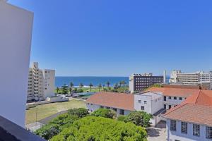 a view of a city with the ocean in the background at SIX ON N - Fluent Serviced Apartments in Cape Town