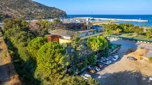 an aerial view of a building with a parking lot at Selinus Beach Club Hotel in Gazipasa