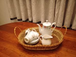 a basket with tea sets on a table at Home Stay Residence - Near Airport in Negombo