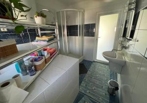 a bathroom with a sink and a toilet in a room at Apartmán Víťazov in Trenčín +26 photos
