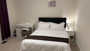 a bedroom with a bed and a desk at Halton Hills Haven in Milton