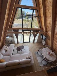 an overhead view of a living room with a large window at Villa Silence in Žabljak