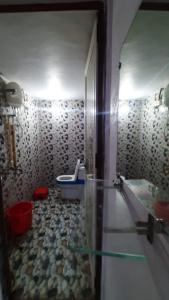 a bathroom with a shower and a sink and a toilet at Hotel Rajganga in Gonda