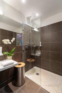 a bathroom with a shower with a glass door at Emma Apartments- self- check -in in Piesendorf +125 photos