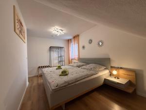 a bedroom with a large bed in a room at Ferienwohnung Regel in Lauingen