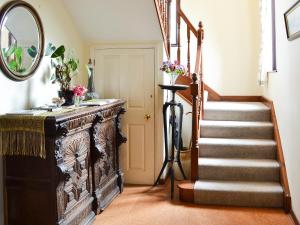 a staircase in a home with a mirror at The Gazebo in Marazion