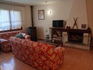 a living room with a couch and a fireplace at CR TESOL 6 SON - ALT ANEU in Son