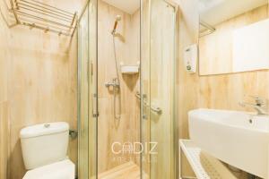 a bathroom with a shower and a toilet and a sink at Hospederia IMAR by Cadiz4Rentals in Cádiz +15 photos