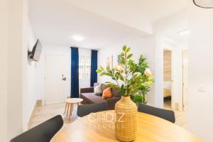 a living room with a table and a couch at Hospederia IMAR by Cadiz4Rentals in Cádiz