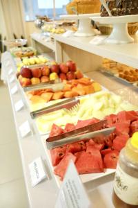 a buffet with many different types of fruit on display at Diamante Rosa Palace Hotel in Coromandel