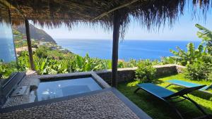 a view of the ocean from a villa at Torre Bella Gardens in Arco da Calheta +89 photos