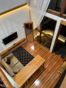 an overhead view of a living room with a couch at Asokabin House in Diyeng
