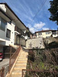 a house with a staircase in front of a building at One Love 2 in Sarajevo