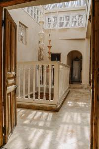 an open hallway with a staircase in a house at Authentic Riad - Sea View & Rooftop Spa in Essaouira