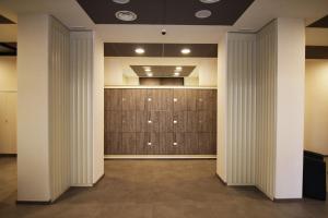 a walk in closet with wood paneling and a wall at Sole Hotel Verona in Verona