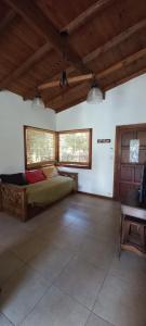 a bedroom with a bed and a desk in a room at Cabañas del Gordo in Mar del Plata +66 photos