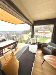 a living room with a couch and a table at Wohnen am Südhang in Amberg