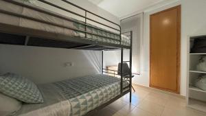 a bedroom with two bunk beds in a room at Apartamento La Calma in Lliber +21 photos