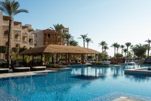 a pool at a resort with a gazebo and palm trees at Grand Palace - Couples only 18 years plus in Hurghada +57 photos