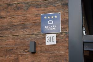a sign on the side of a building with stars on it at Villa Green Relax in Gornji Mihaljevec