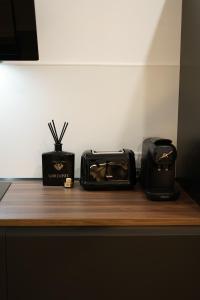 a counter with two toasters and a toaster on it at Cliff Appart in Valencia +18 photos