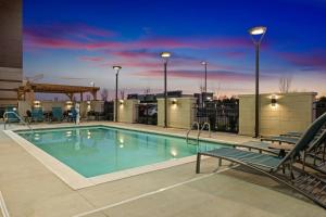 a swimming pool on the roof of a building at TownePlace Suites by Marriott Murfreesboro in Murfreesboro